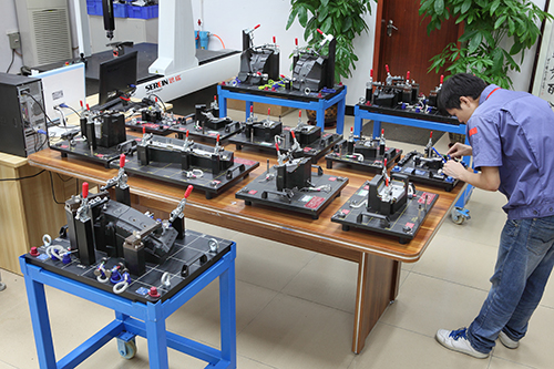 Inspect parts on checking fixture